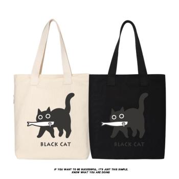 秀洛修貓叼魚的小黑貓卡通帆布包袋學生手提包斜挎包購物袋子書包