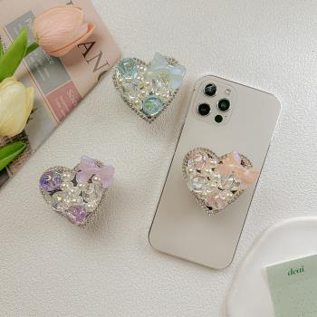 手機氣囊支架韓國ins珍珠水鉆炫彩蝴蝶結愛心背貼輕奢可伸縮桌面