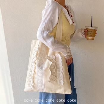 coke奶黃色花邊設計帆布單肩包小眾款復古甜美仙女拼接布袋手提包