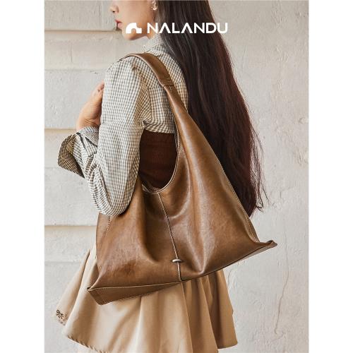 納蘭杜托特包女大容量2025新款大包包高級女士帆布包單肩通勤女包