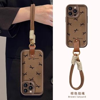 適用蘋果16手機殼新款黑色蝴蝶結掛繩iPhone15promax外殼輕奢高級感14pro全包防摔13女款氣質12咖色小羊皮ins