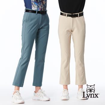 【Lynx Golf】女款彈性舒適口袋壓線造型緹織LOGO鬆緊帶剪接設計靴型九分褲(二色)