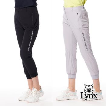 【Lynx Golf】首爾高桿風格！女款彈性舒適素面LOGO織帶剪接設計拉鍊口袋羅紋縮口窄管九分褲-淺灰色