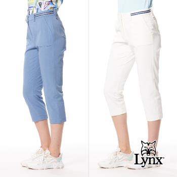 【Lynx Golf】女款日本進口布料抗UV接觸冷感機能織帶剪接設計帆船繡花造型窄管七分褲-白色